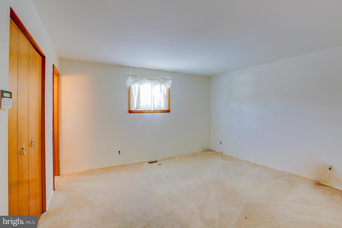 9007 Fieldchat Road Baltimore, MD 21236 - Photo 14 of 30 an empty room with windows and closet