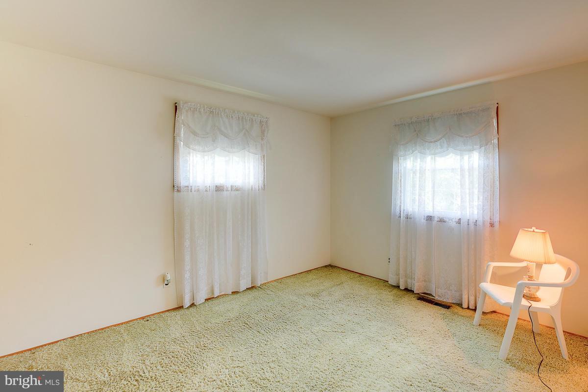 9007 Fieldchat Road Baltimore, MD 21236 - Photo 17 of 30 a view of an empty room with a window