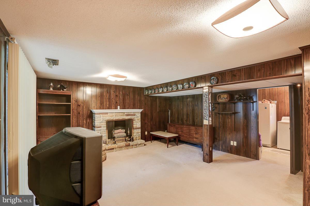 9007 Fieldchat Road Baltimore, MD 21236 - Photo 21 of 30 a view of a livingroom with furniture and a fireplace