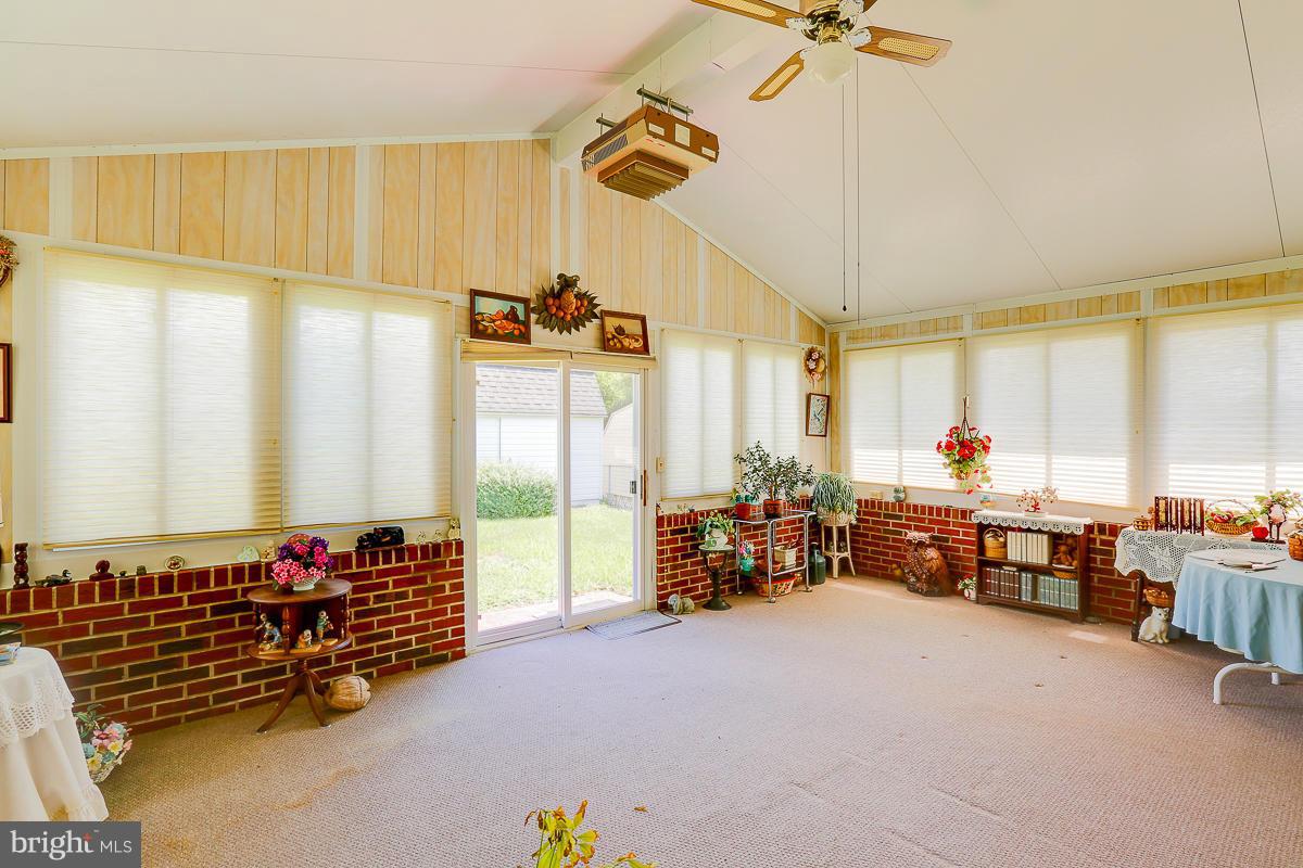 9007 Fieldchat Road Baltimore, MD 21236 - Photo 23 of 30 a bedroom with furniture and a large window