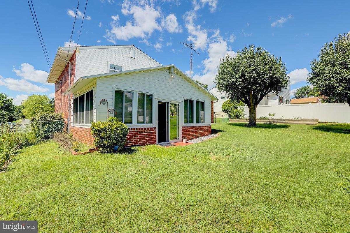 9007 Fieldchat Road Baltimore, MD 21236 - Photo 26 of 30 a front view of a house with a yard