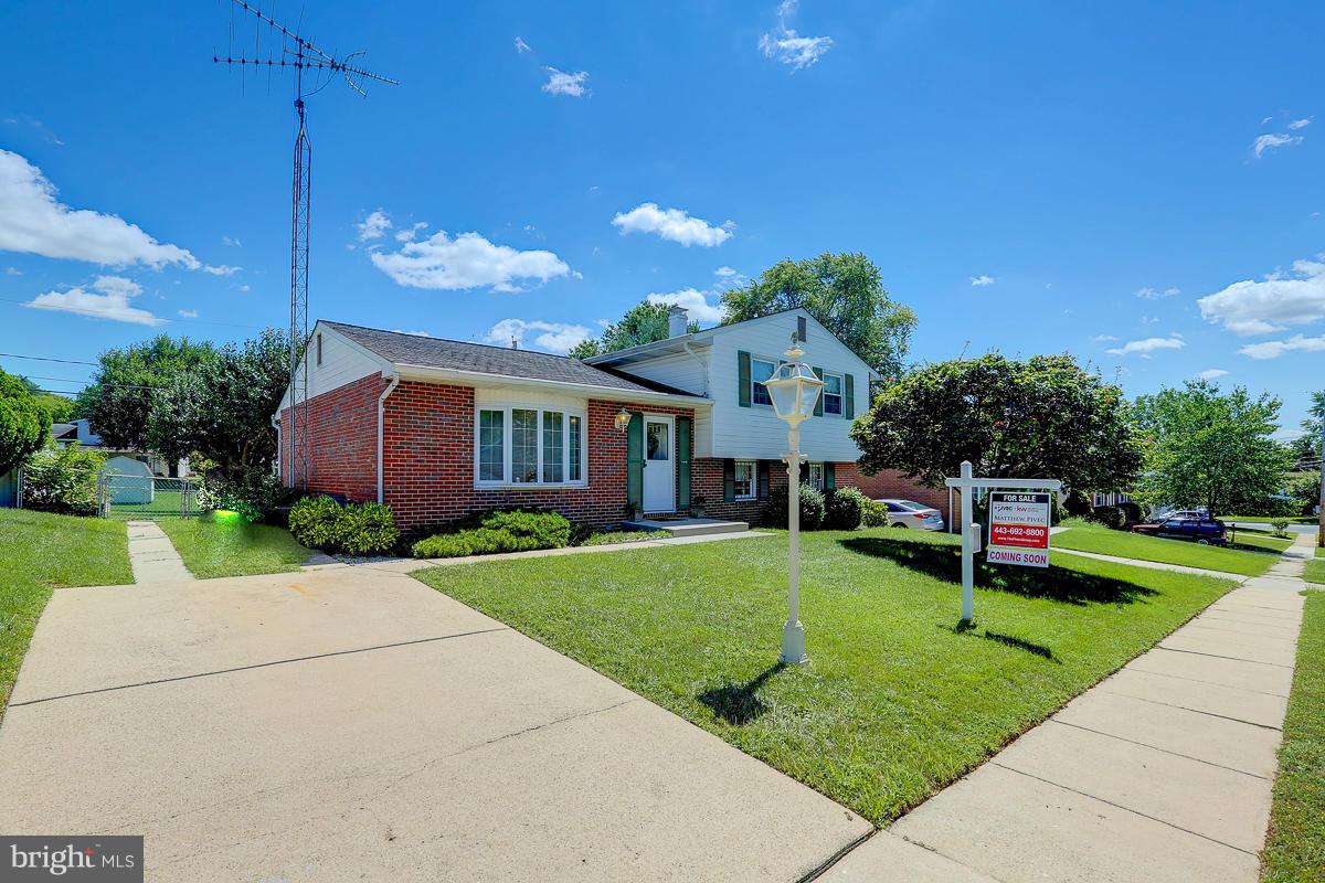 9007 Fieldchat Road Baltimore, MD 21236 - Photo 28 of 30 a front view of a house with a yard