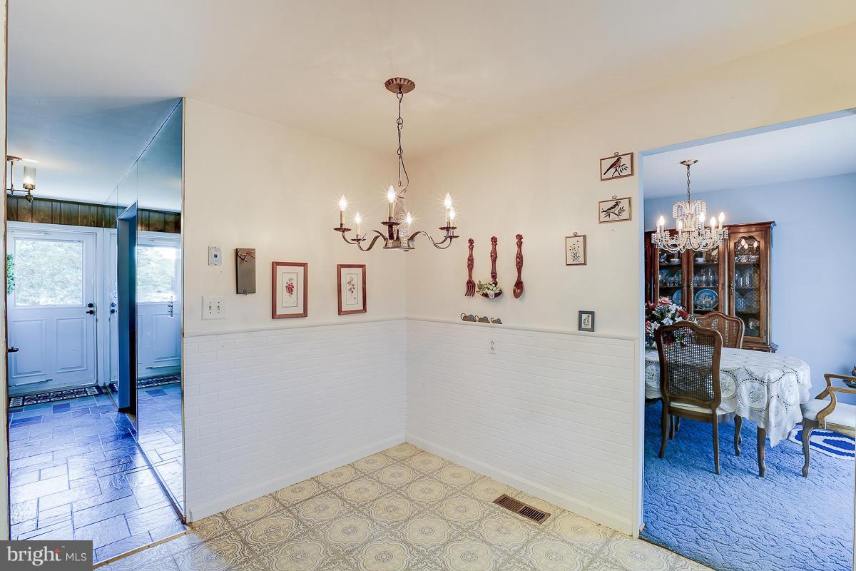 9007 Fieldchat Road Baltimore, MD 21236 - Photo 5 of 30 a view of a kitchen and dining room