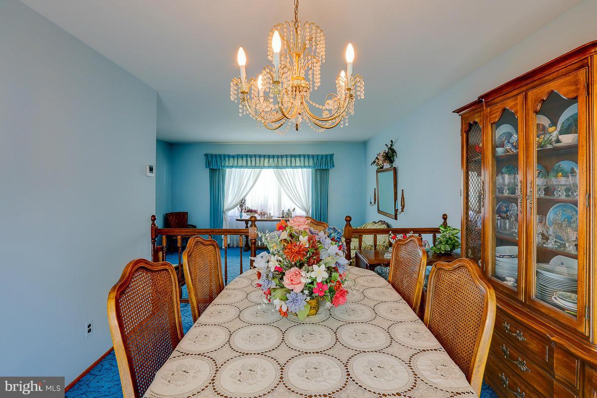 9007 Fieldchat Road Baltimore, MD 21236 - Photo 6 of 30 a view of a dining room with furniture window and outside view