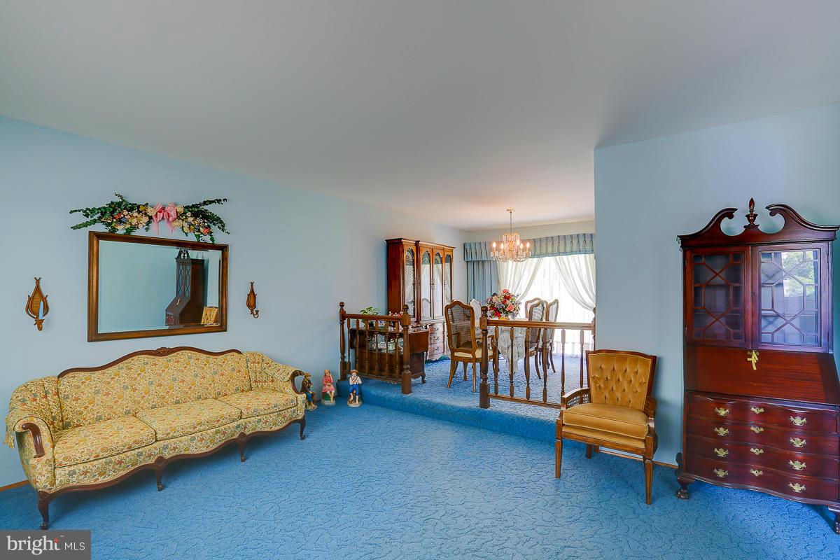 9007 Fieldchat Road Baltimore, MD 21236 - Photo 9 of 30 a bedroom with furniture and a couch