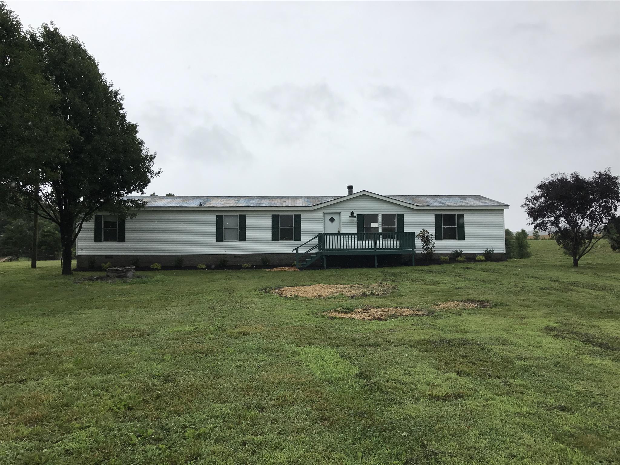6029 McDaniels Road Springfield, TN 37172 - Photo 1 of 14 a front view of a house with a garden