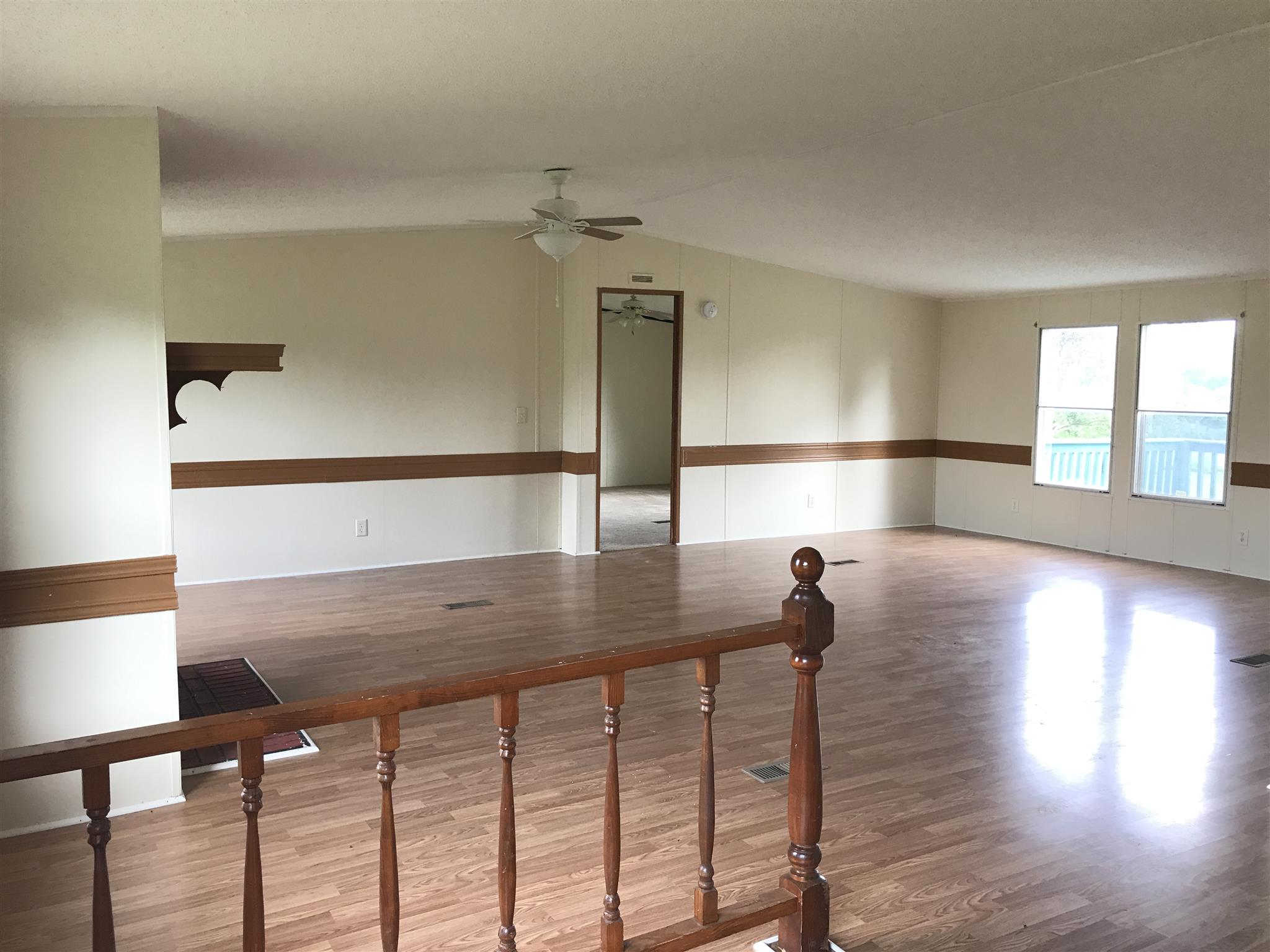 6029 McDaniels Road Springfield, TN 37172 - Photo 3 of 14 a view of a hallway with wooden floor and chair
