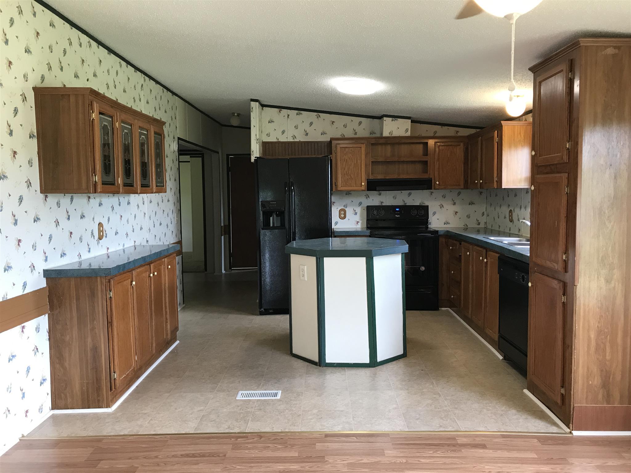 6029 McDaniels Road Springfield, TN 37172 - Photo 4 of 14 a kitchen with stainless steel appliances granite countertop a stove and a sink