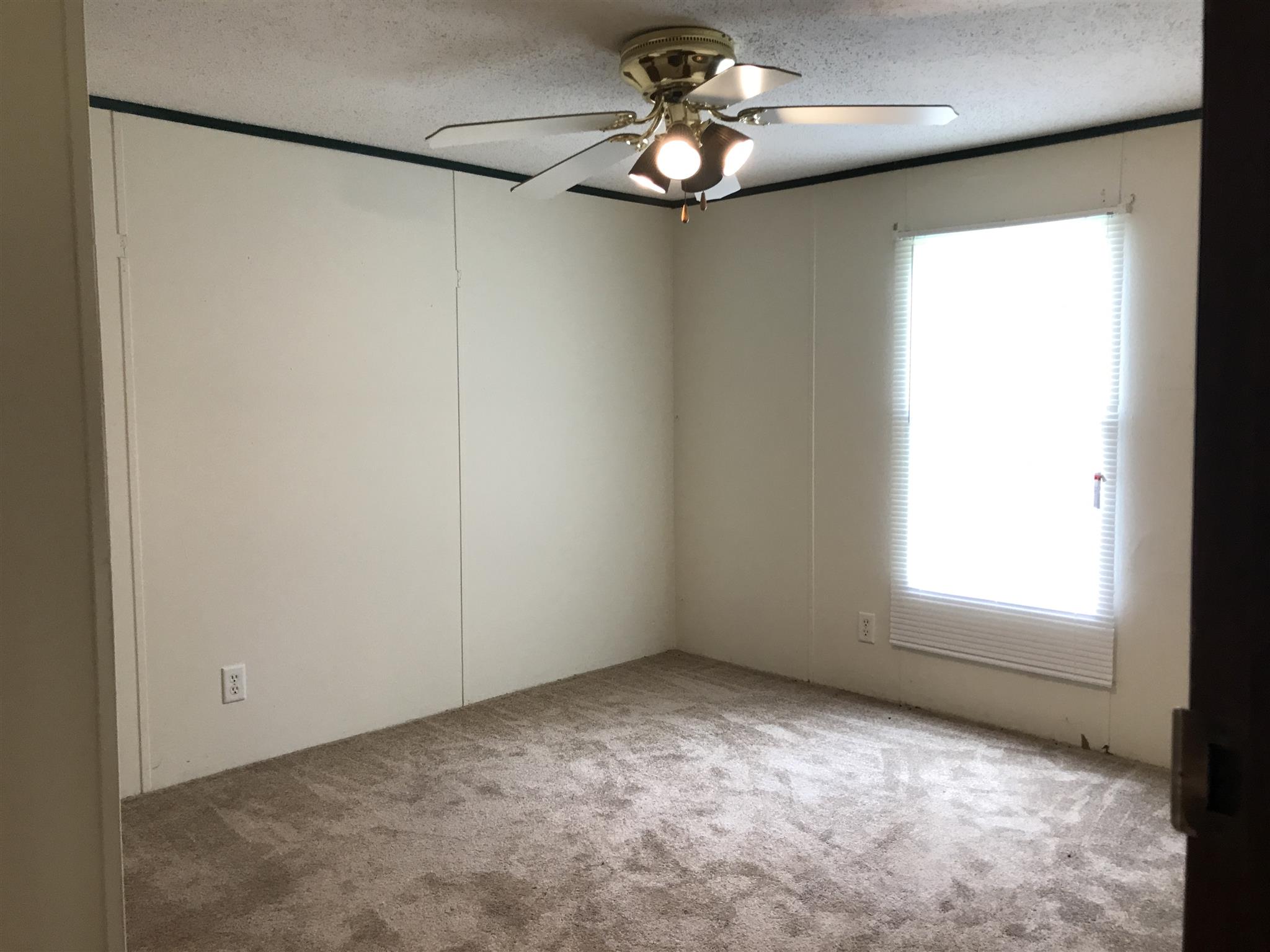 6029 McDaniels Road Springfield, TN 37172 - Photo 9 of 14 a view of an empty room with a window