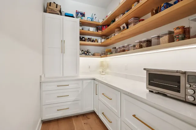 a close view of a stove and cabinets