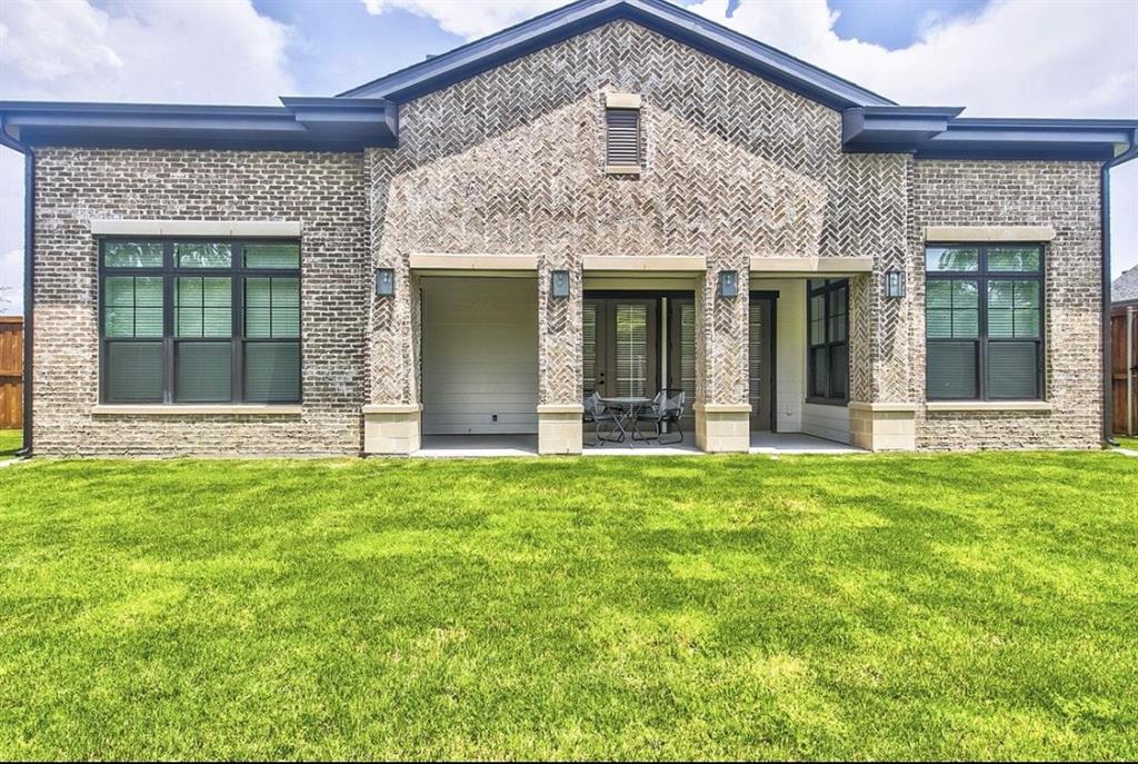 12001 Inwood Road, Unit 3501 Dallas, TX 75244 - Photo 13 of 15 Back of property featuring a yard and a patio