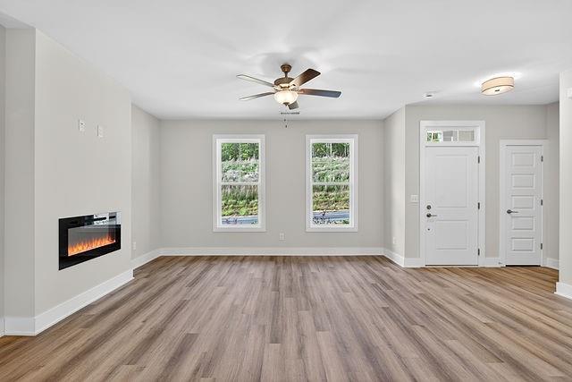 2562 Harbor Ridge Pass Gainesville, GA 30507 - Photo 8 of 27 wooden floor in an empty room with a window