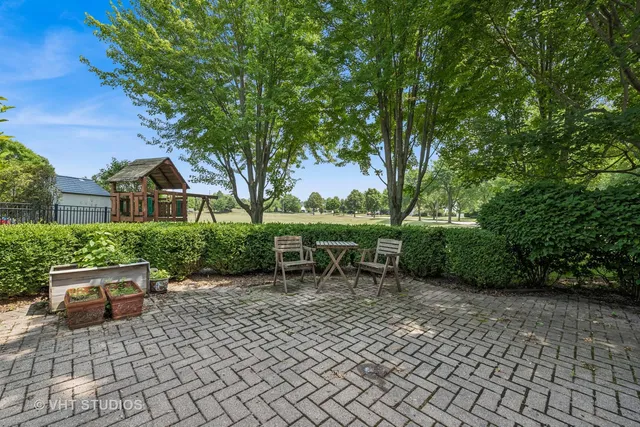 a backyard of a house with yard and outdoor seating