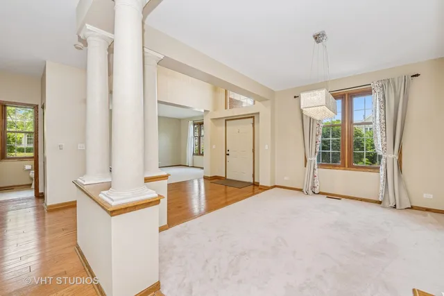 a view of kitchen with sink and wooden floor