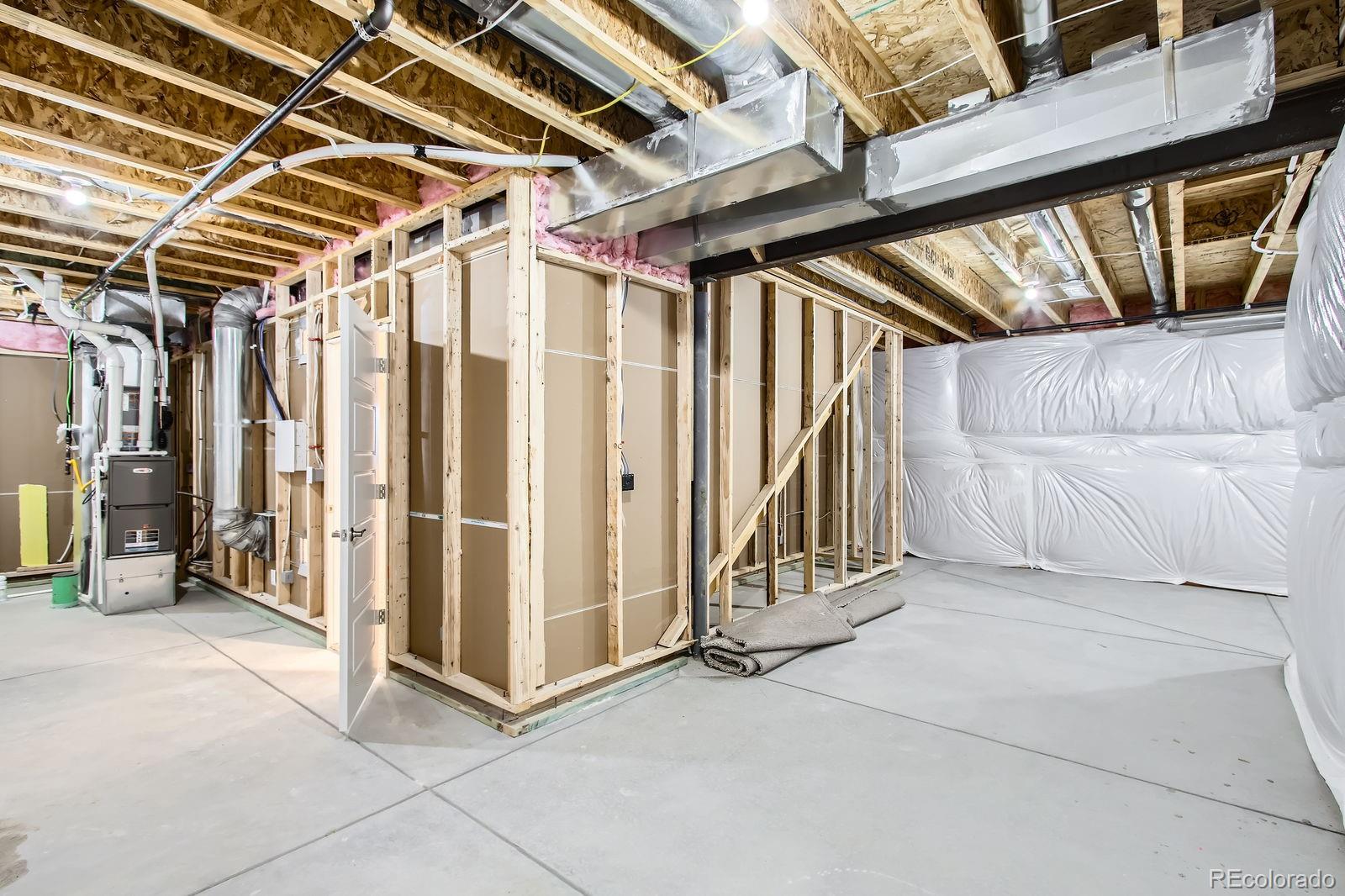 9085 Rifle Street Commerce City, CO 80022 - Photo 24 of 31 a view of a room with wooden walls