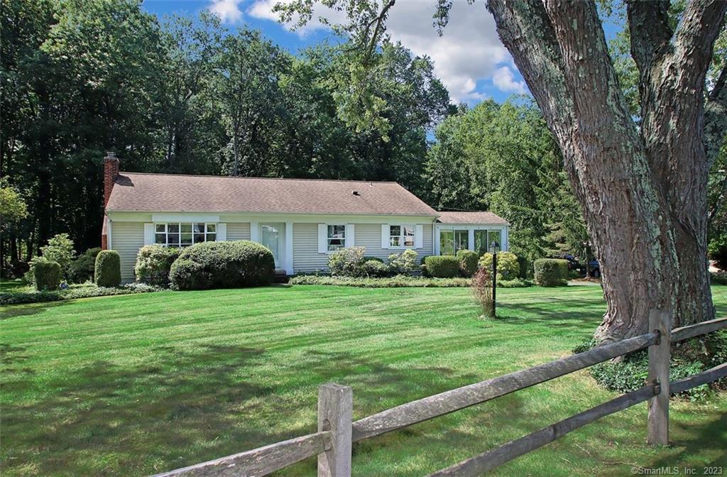 251 Bittersweet Road Orange, CT 06477 - Photo 1 of 1 a aerial view of a house next to a big yard and large trees