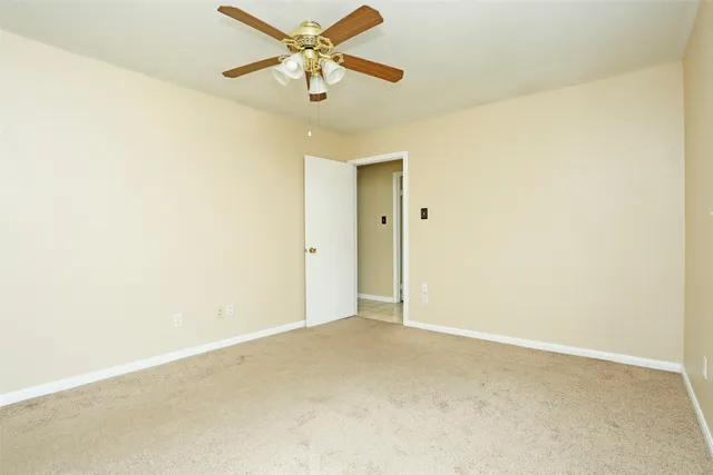 a view of a house with a yard and porch