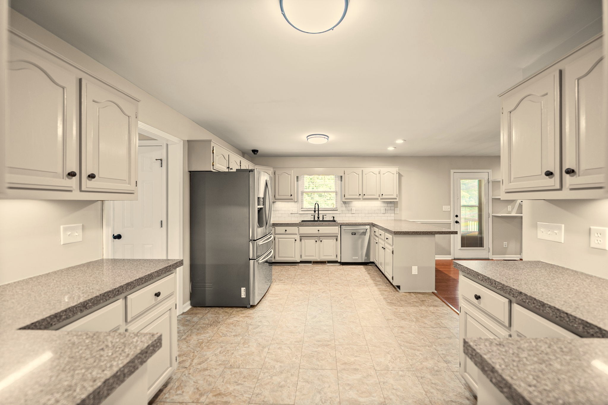 748 Gholson Road Clarksville, TN 37043 - Photo 24 of 87 a kitchen with stainless steel appliances granite countertop a refrigerator sink and white cabinets