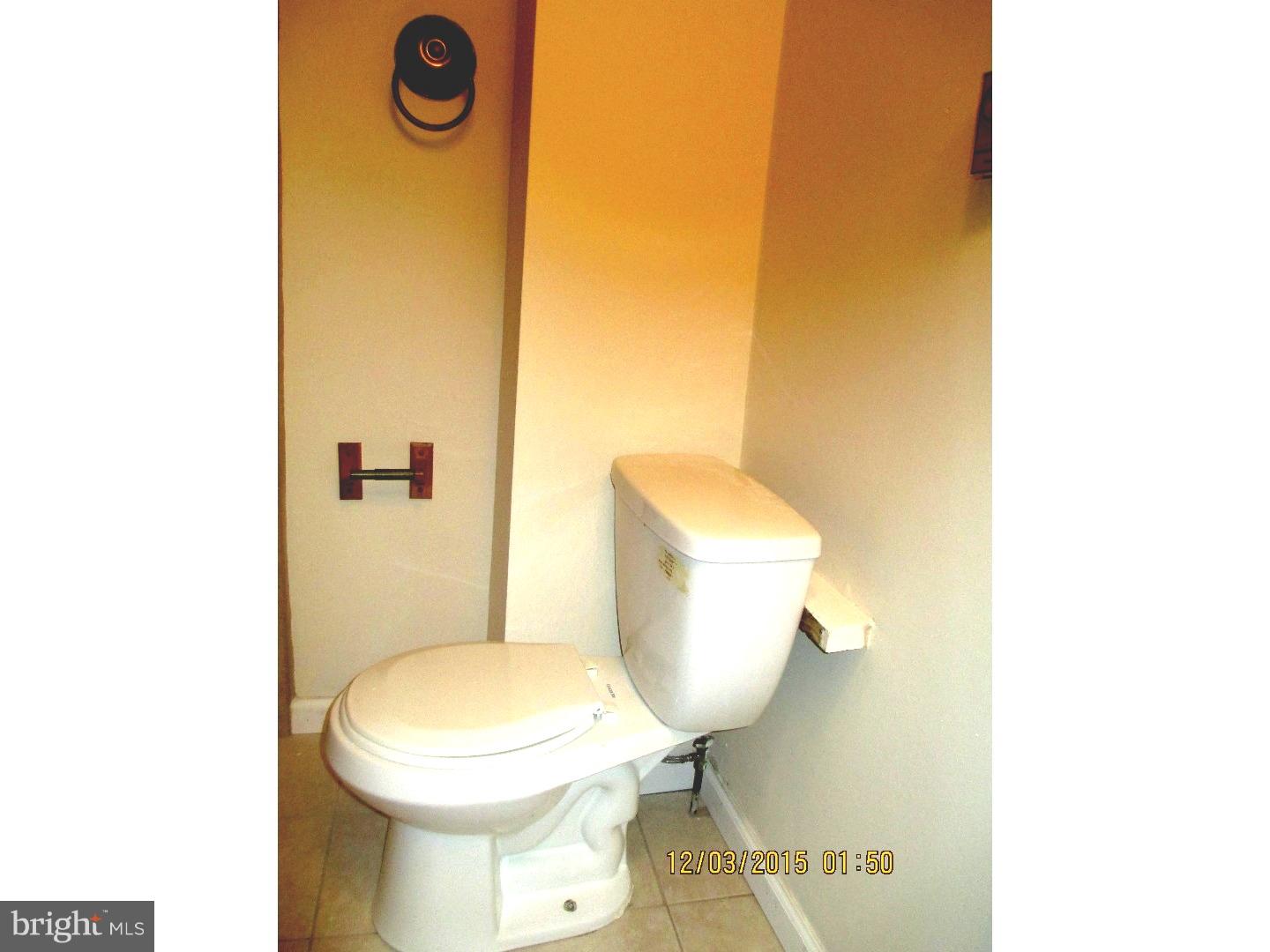 2124 South 15th Street Philadelphia, PA 19145 - Photo 13 of 14 a white toilet sitting next to a sink
