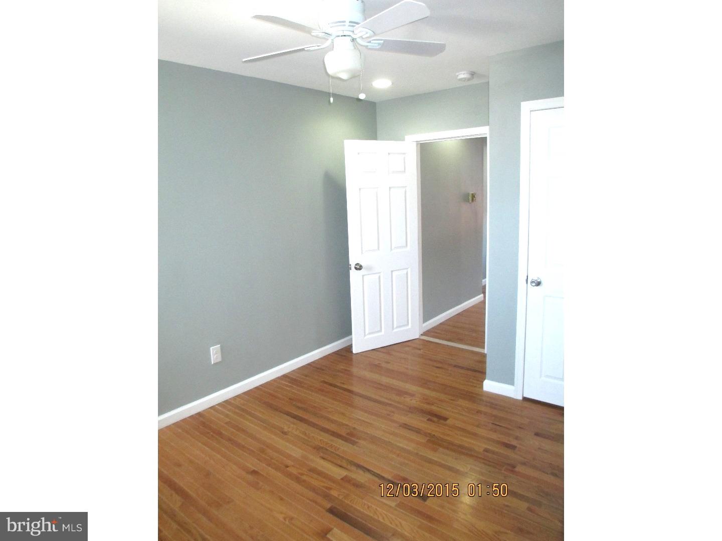 2124 South 15th Street Philadelphia, PA 19145 - Photo 10 of 14 a view of an empty room with wooden floor