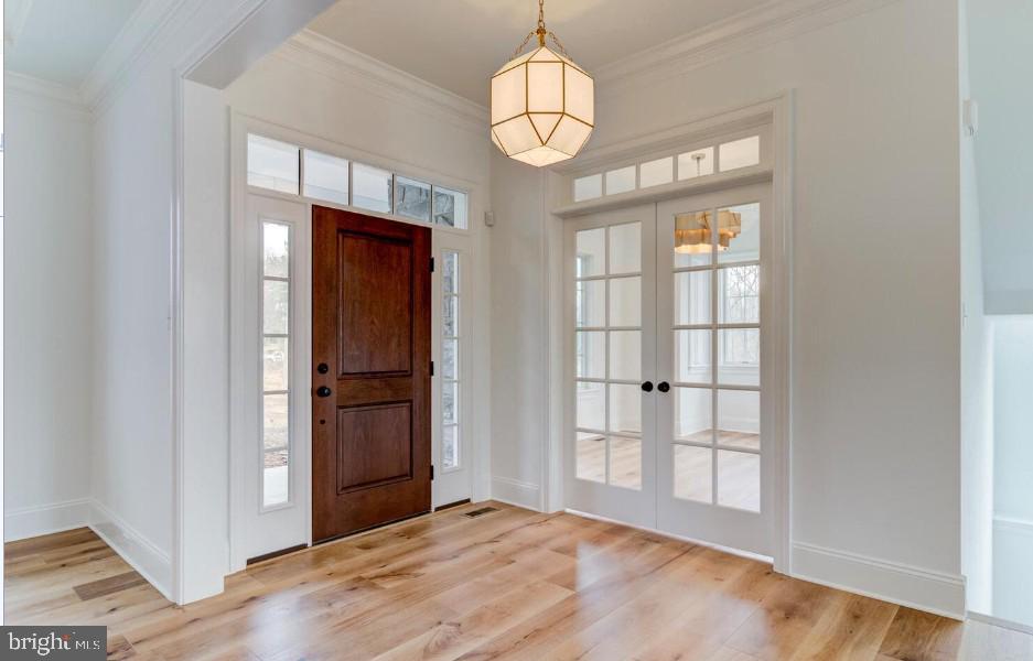 109 Palmetto Devon, PA 19333 - Photo 1 of 14 an empty room with wooden floor cabinet and windows