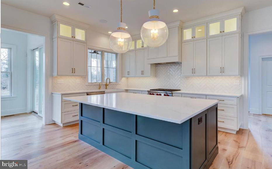 109 Palmetto Devon, PA 19333 - Photo 4 of 14 a kitchen with a sink cabinets and wooden floor
