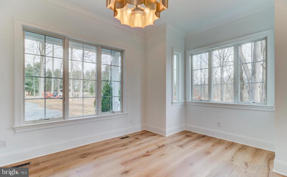 109 Palmetto Devon, PA 19333 - Photo 5 of 14 a view of an empty room with wooden floor and a window