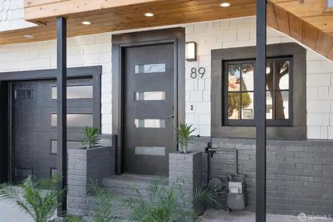 a kitchen with stainless steel appliances granite countertop a stove a sink dishwasher and a refrigerator with wooden floor