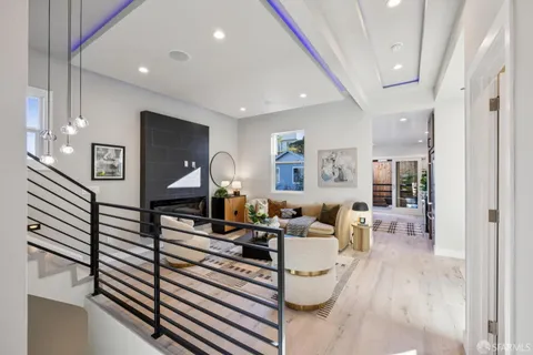 a kitchen with stainless steel appliances a sink stove and cabinets