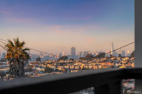 a living room with furniture a rug and a mirror