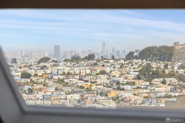 a view of house with outdoor seating space and wooden floor
