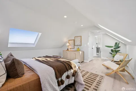 a bedroom with a bed and a dresser