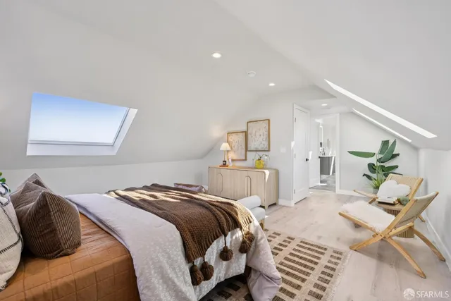 a bedroom with a bed and a dresser