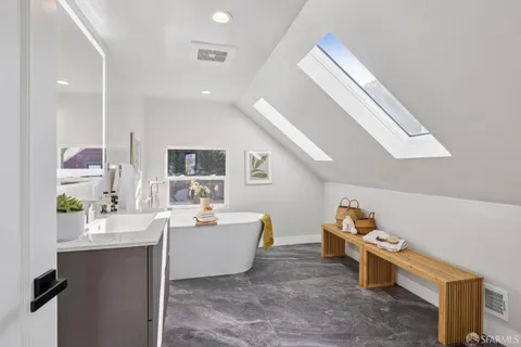 a view of a glass door with a balcony from a window