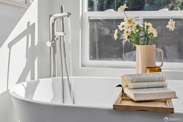 a bedroom with bed and a window