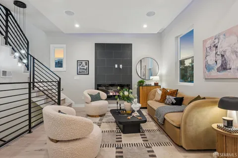 a view of living room with furniture and a lamp