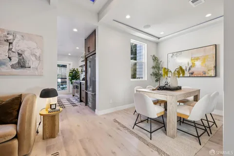 a living room with furniture potted plant and a window