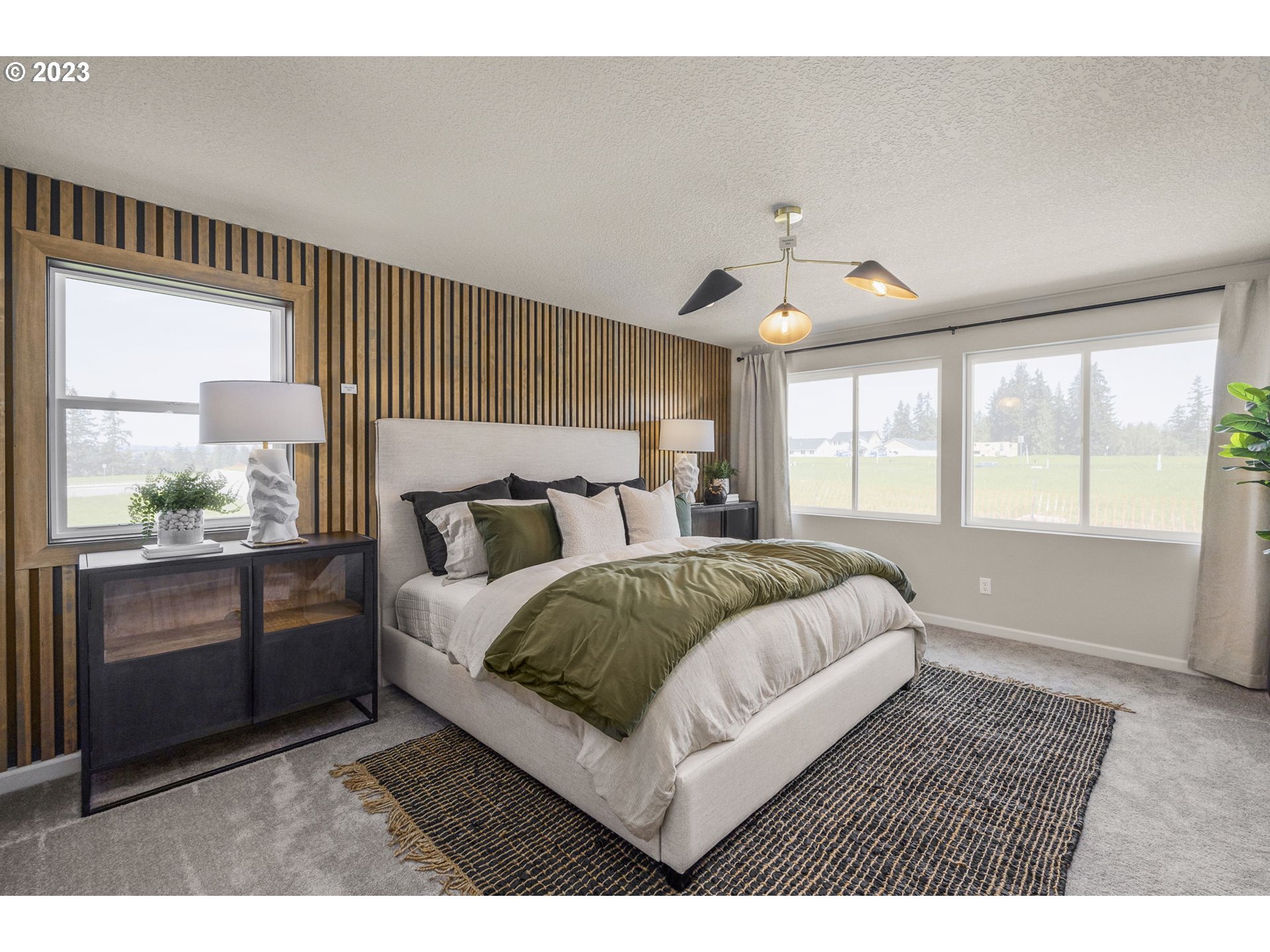 2824 South 7th Circle Ridgefield, WA 98642 - Photo 18 of 33 a bedroom with a large bed and a window
