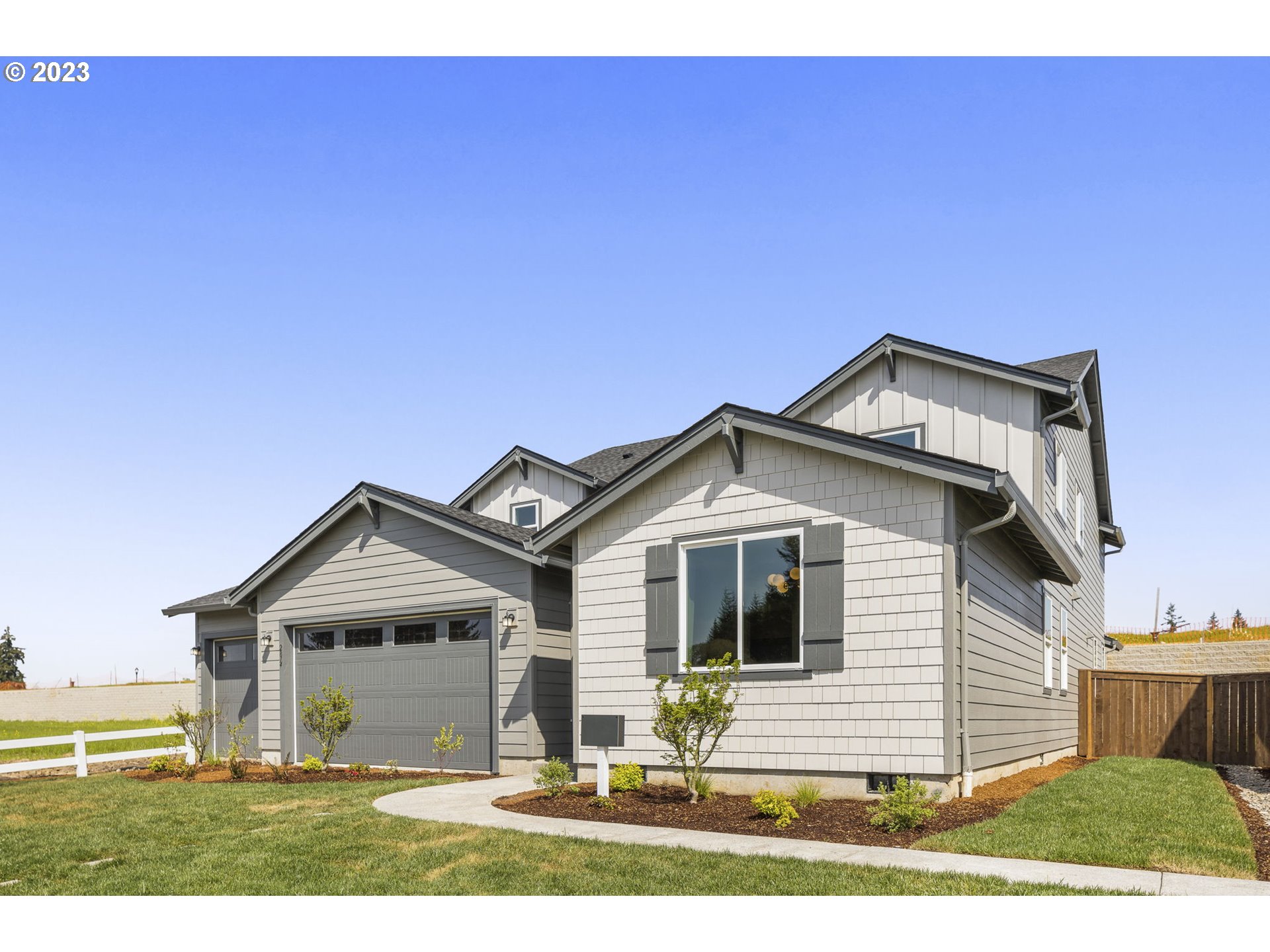 2824 South 7th Circle Ridgefield, WA 98642 - Photo 23 of 33 a front view of a house with a yard