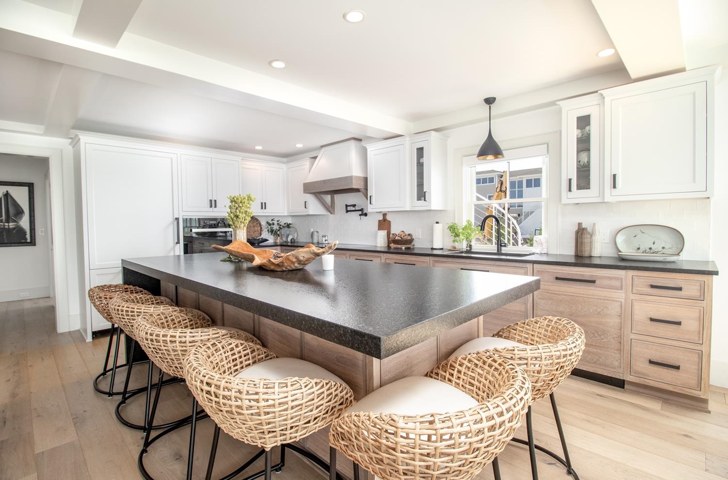 7708 Sunset Drive Avalon, NJ 08202 - Photo 11 of 37 a kitchen with a dining table chairs and white cabinets