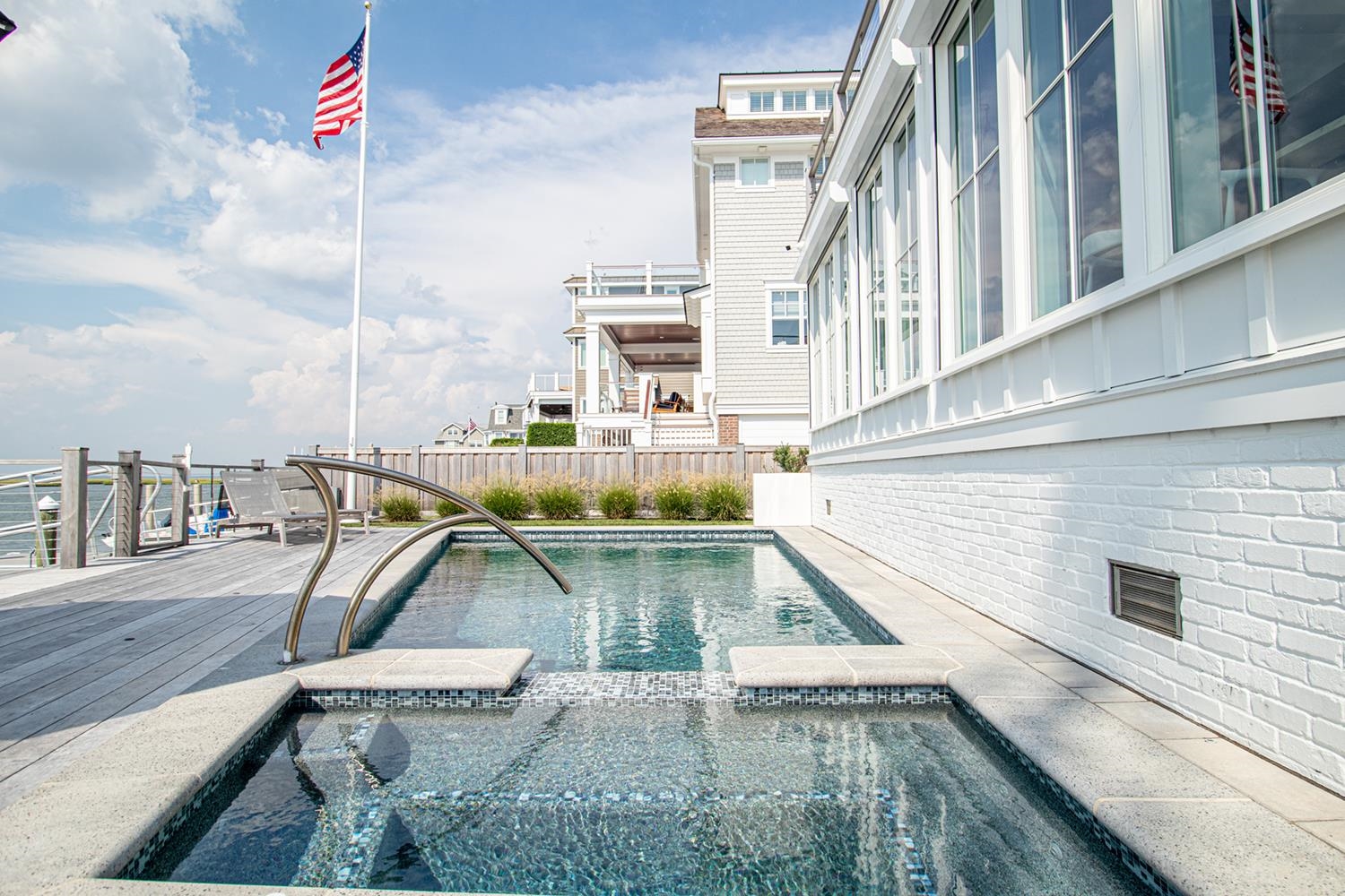 7708 Sunset Drive Avalon, NJ 08202 - Photo 17 of 37 a view of a swimming pool with a chair