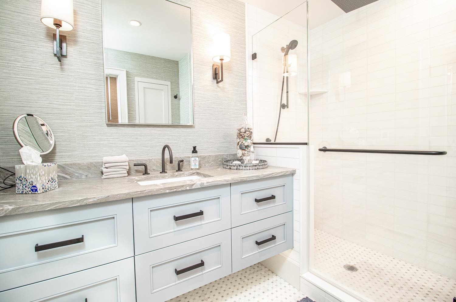 7708 Sunset Drive Avalon, NJ 08202 - Photo 21 of 37 a bathroom with a shower sink vanity and mirror