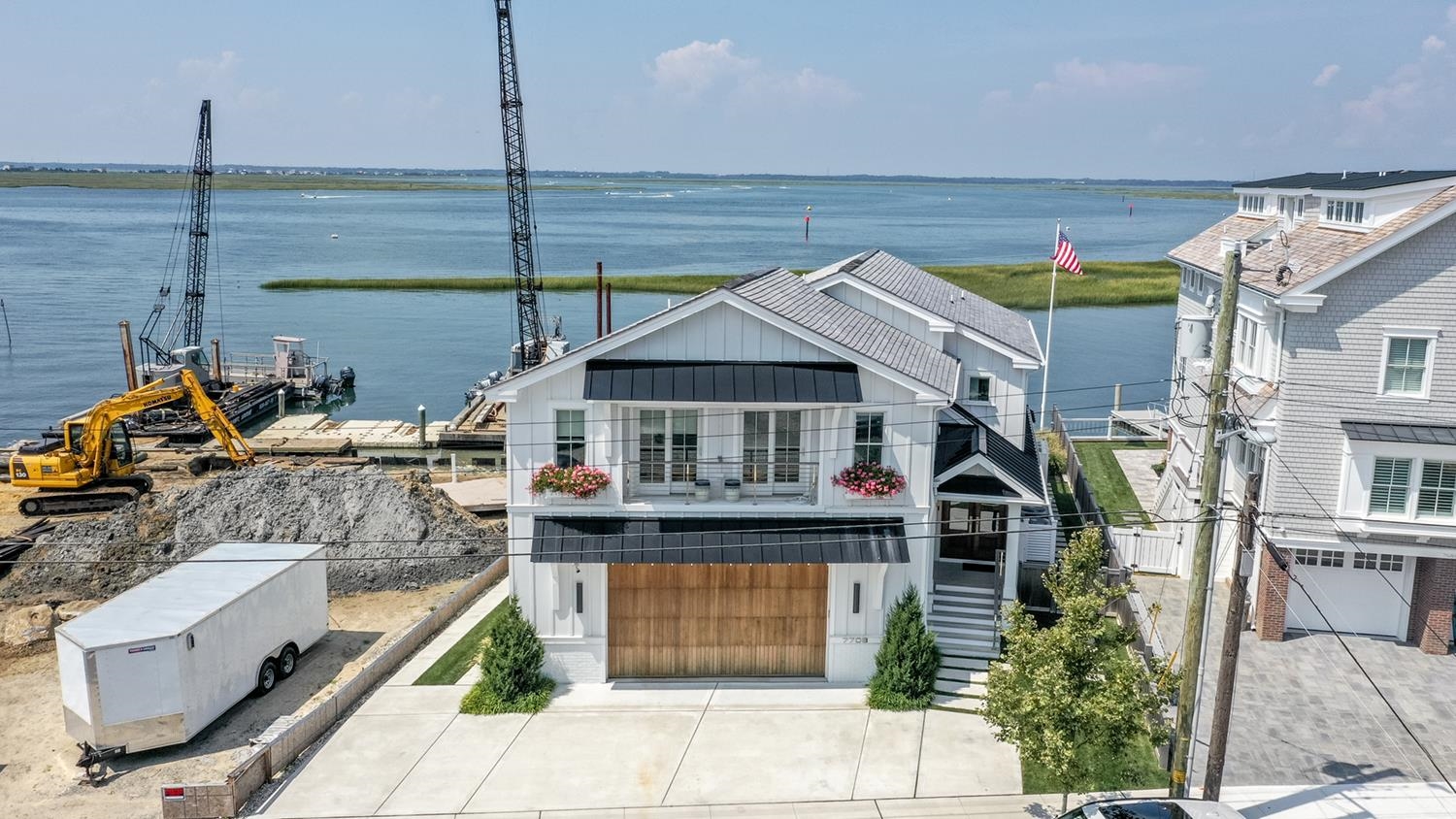 7708 Sunset Drive Avalon, NJ 08202 - Photo 36 of 37 a front view of a house with a garden