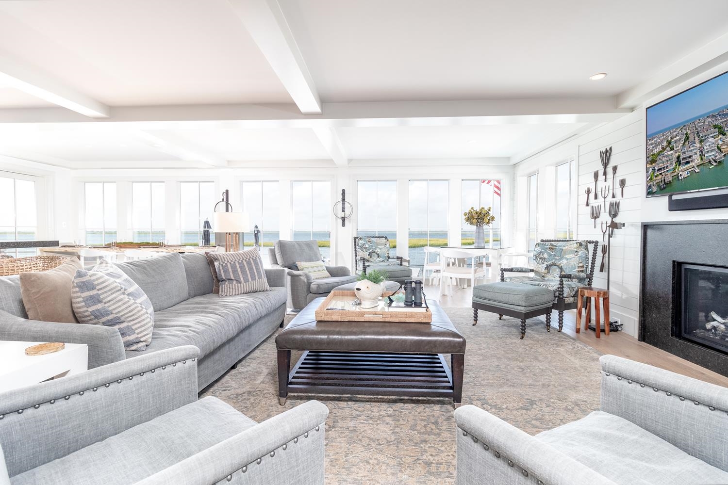 7708 Sunset Drive Avalon, NJ 08202 - Photo 6 of 37 a living room with furniture fireplace and a large window