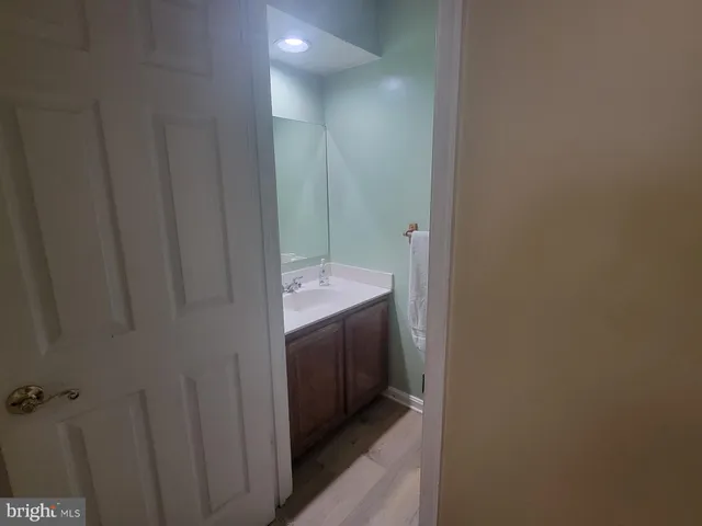 a bathroom with a sink and mirror
