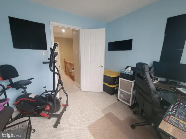 a view of a hallway with workspace