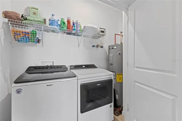 a utility room with dryer and washer
