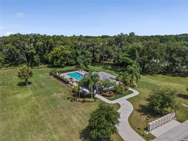 an aerial view of a golf course with parking space