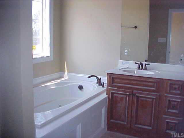 42 Baldwin Ridge Court Willow Spring, NC 27592 - Photo 5 of 8 Master bath has whirlpool, dual vanities - sep. shower