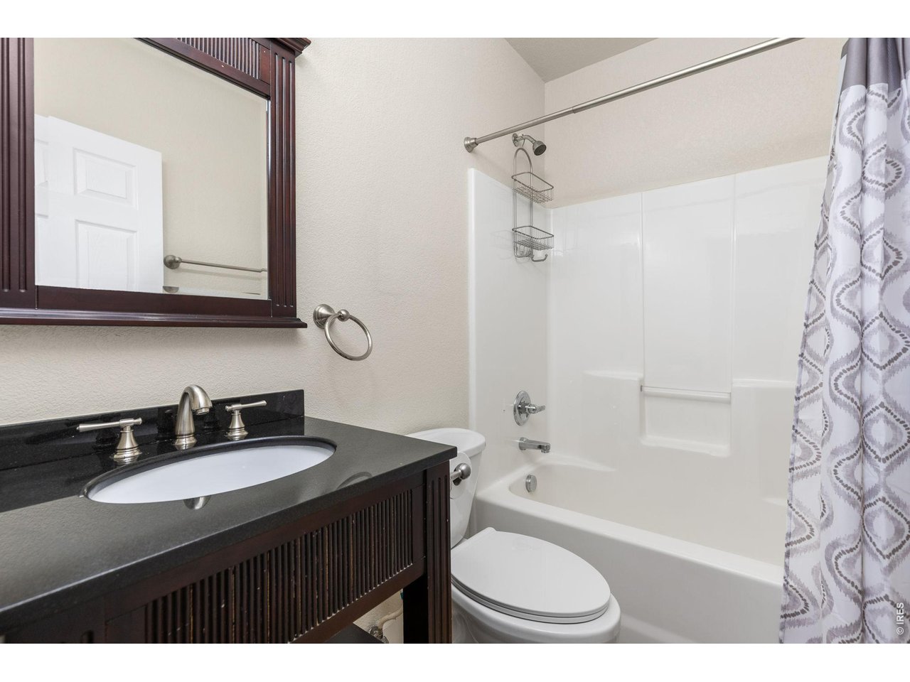 2002 Trail Ridge Drive Severance, CO 80615 - Photo 26 of 50 Main level full bathroom with updated vanity & lighting!